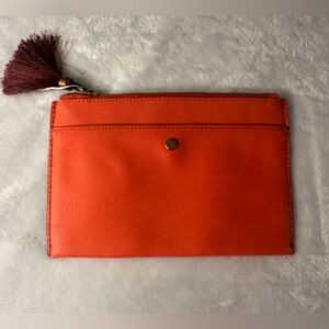J Crew small clutch. Red / orange leather color. EUC